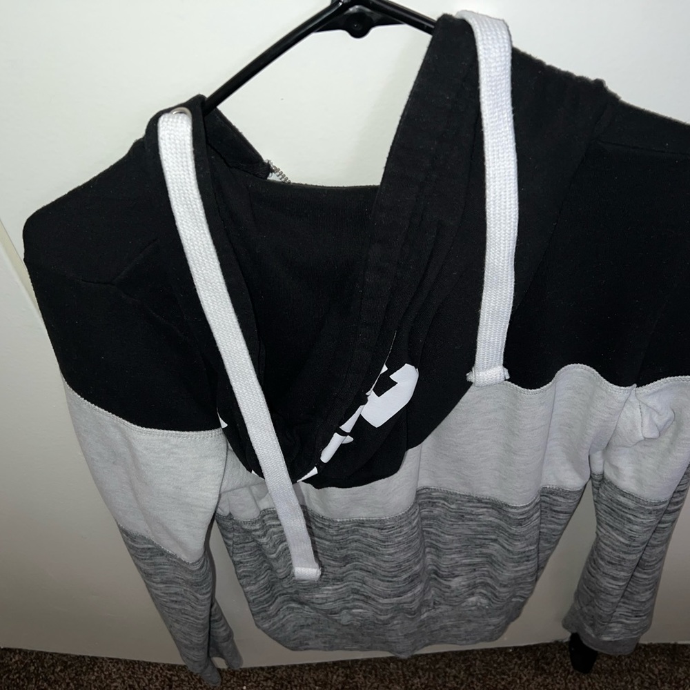 One hoodie and a zip up sweater